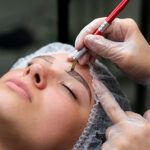 beautician-doing-microblading-procedure-young-woman
